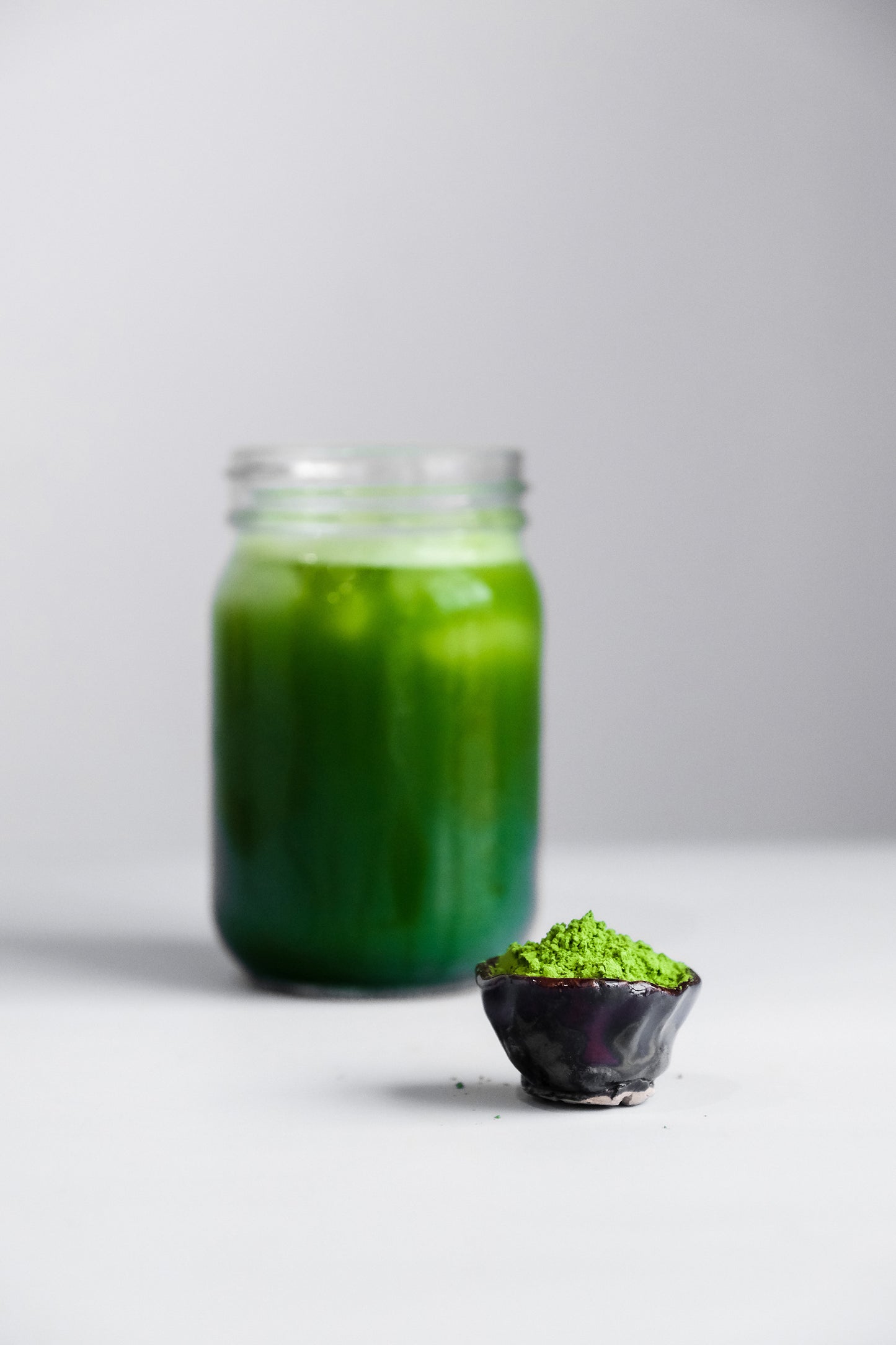 dark green ceremonial matcha tea in mason jar, matcha tea powder, beautiful vibrant green color, fresh matcha